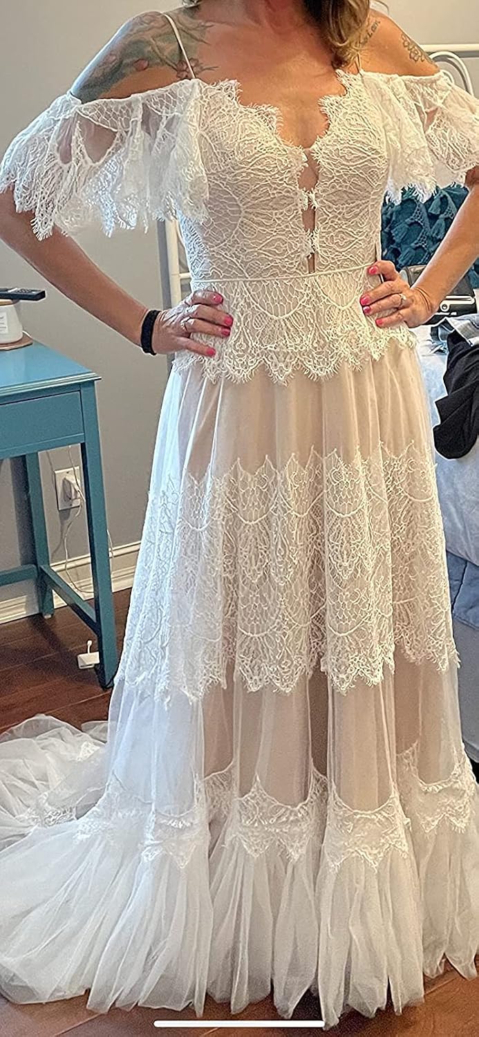 Women's boho lace wedding dress with V-neckline and ruffle sleeves in [color], styled for beach wedding settings — view 5