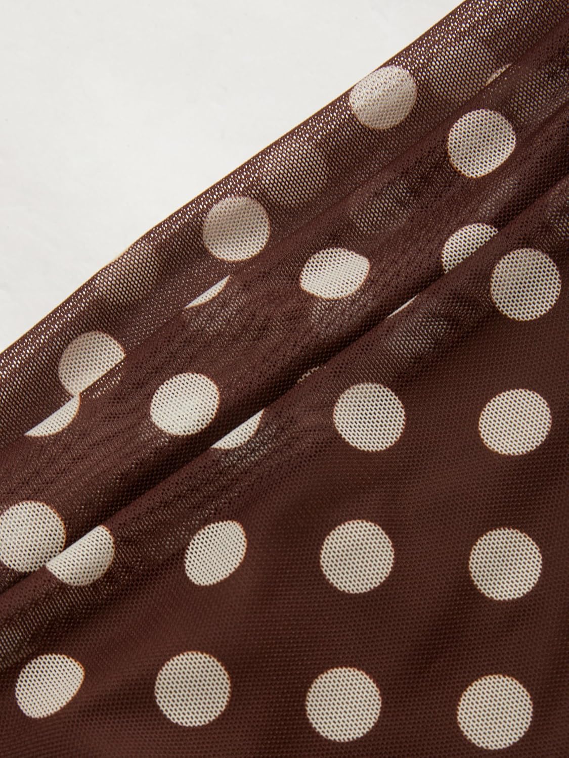 Sleeveless mesh ruffle maxi dress in [color] worn as a wedding guest outfit — detail
